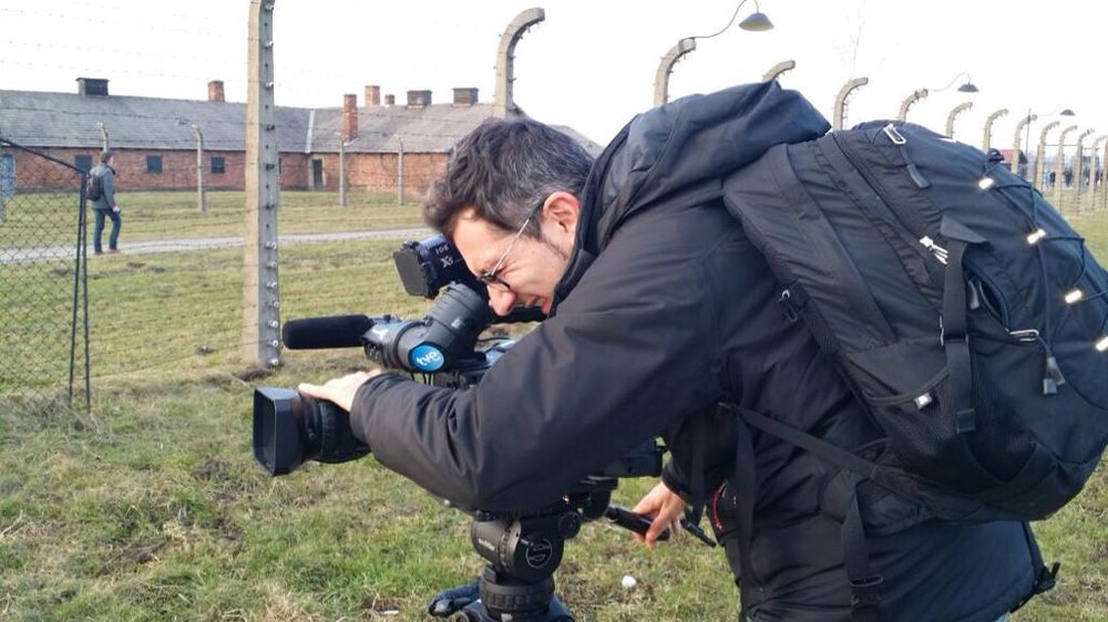 Hector Pulido filming at Auschwitz for TVE